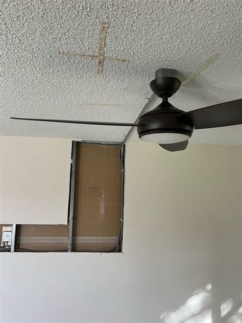 hiding ceiling fan junction box and conduit on concrete 